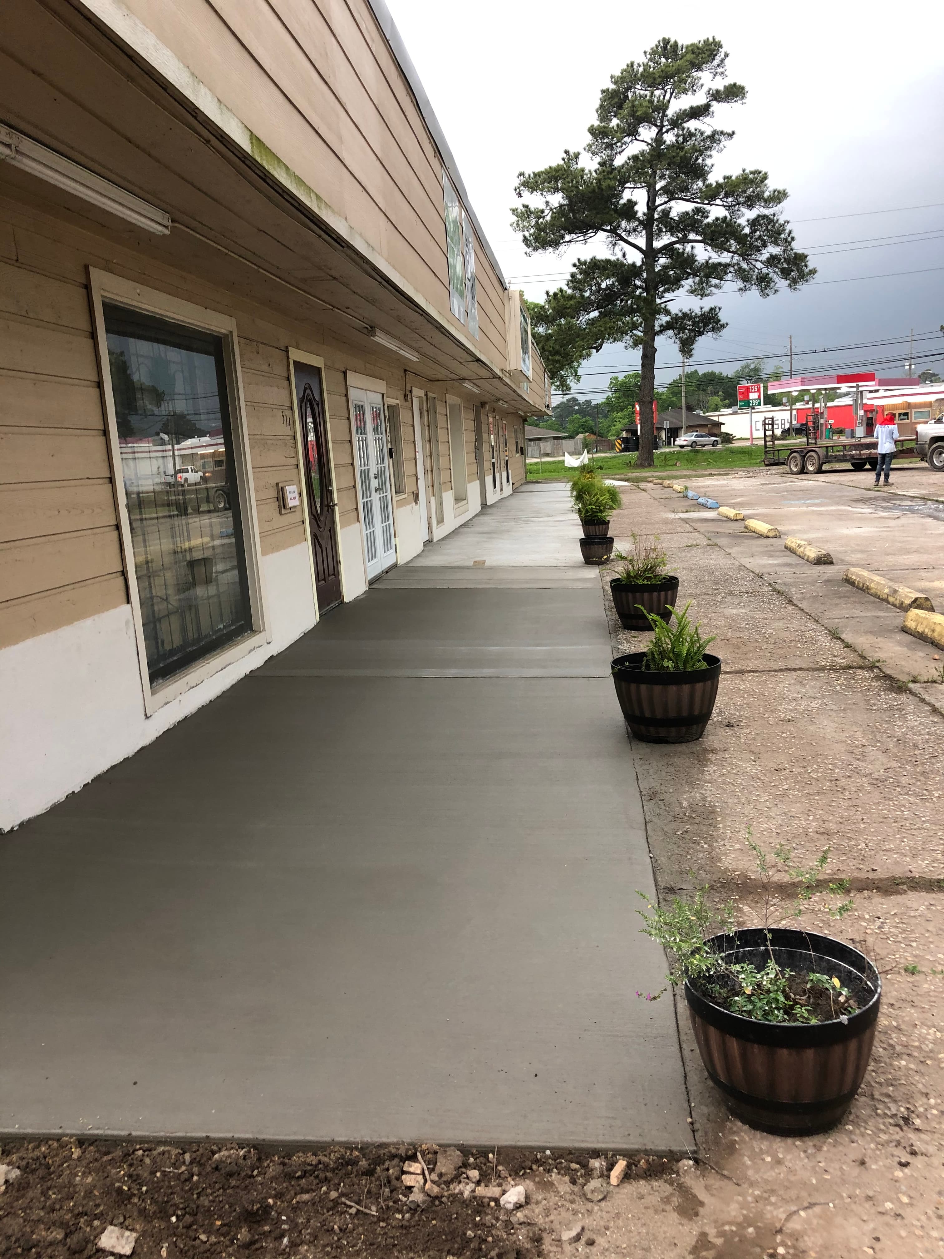 Finished concrete walkway alongside a commercial building