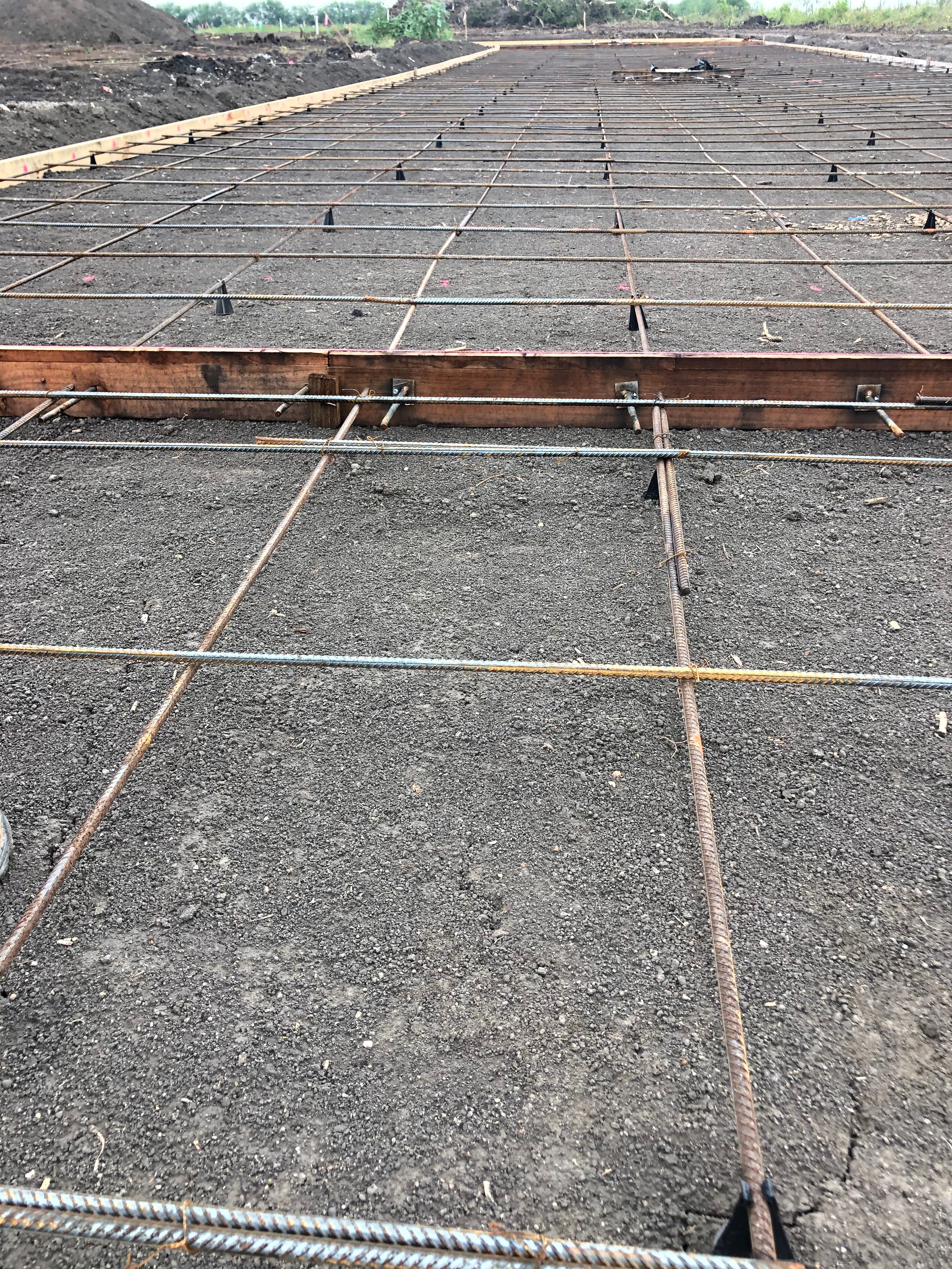 Wide view of a tied rebar foundation grid