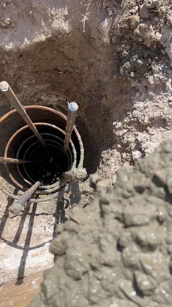 Looking down into a formed pier column with a rebar cage before the pour