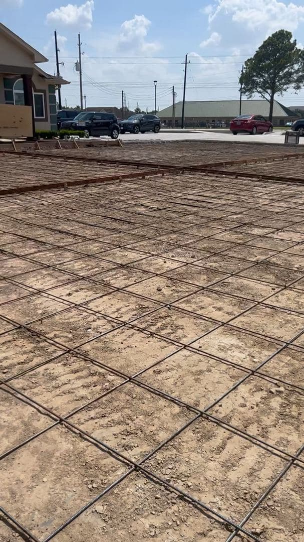 Tying a rebar grid for a slab foundation at a Houston-area home
