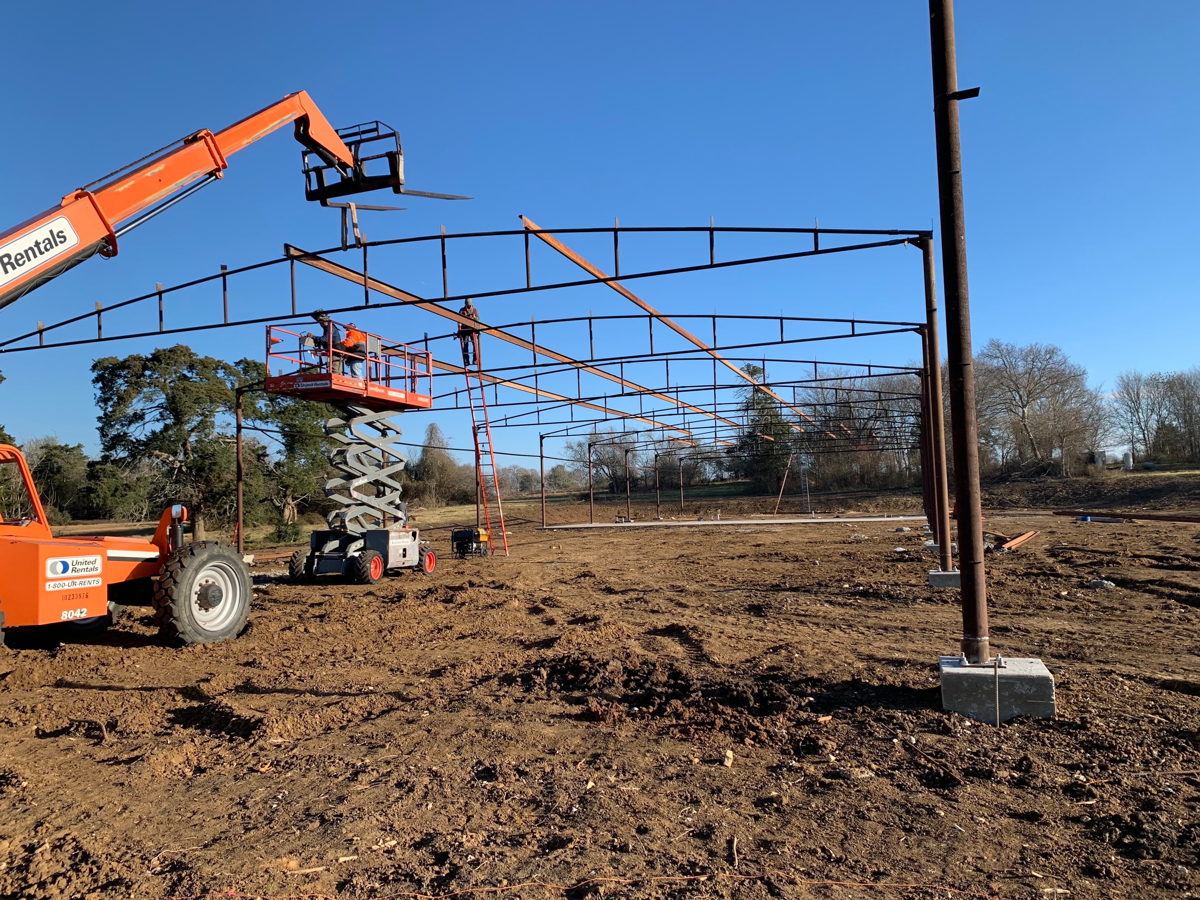 Iron Wolf Concrete crew member tying rebar on a job site