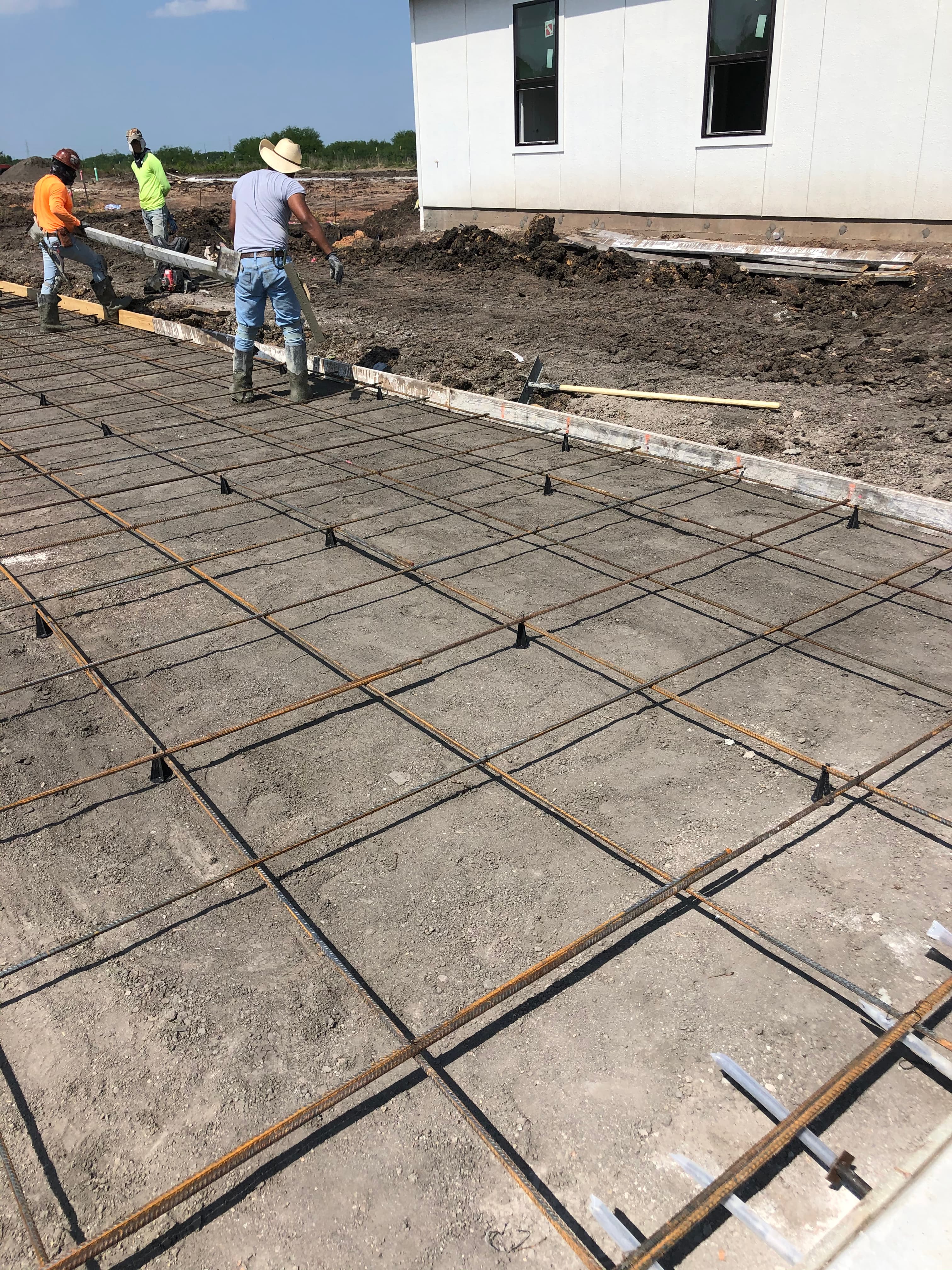 Concrete foundation rebar work on a Houston-area job site