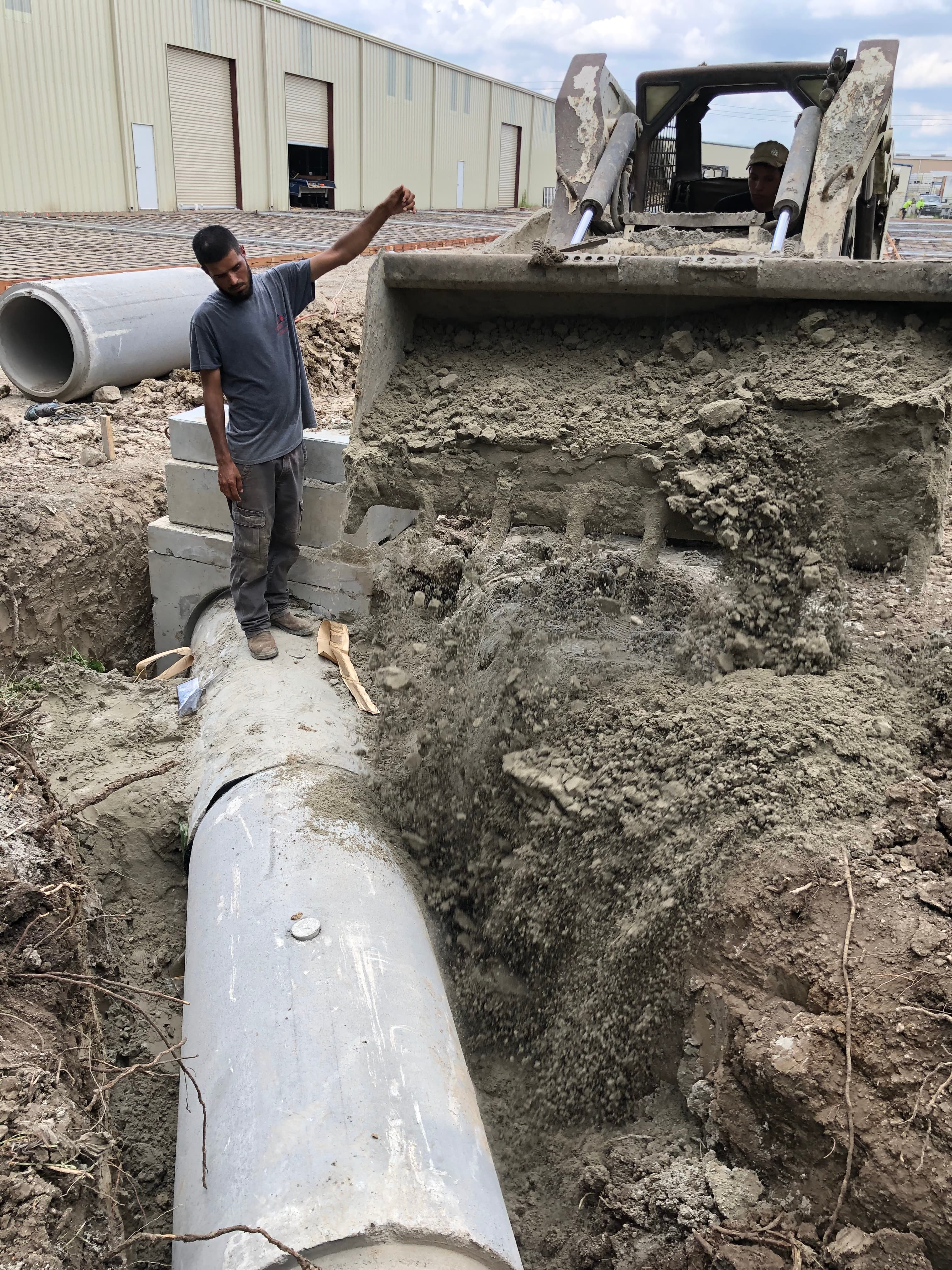 Close-up of a drainage pipe elbow joint being installed