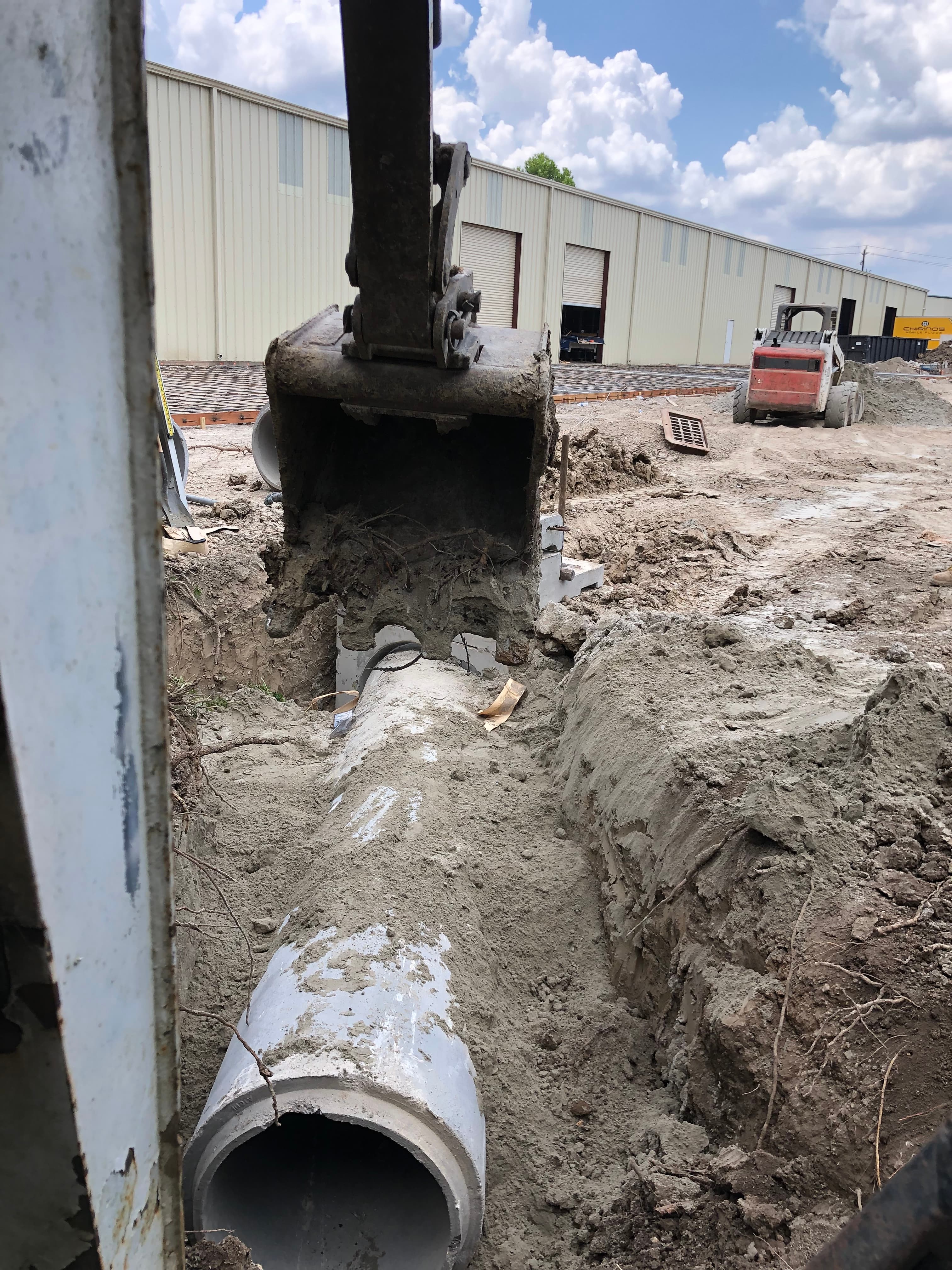 Drainage pipe trench running alongside a Houston-area home