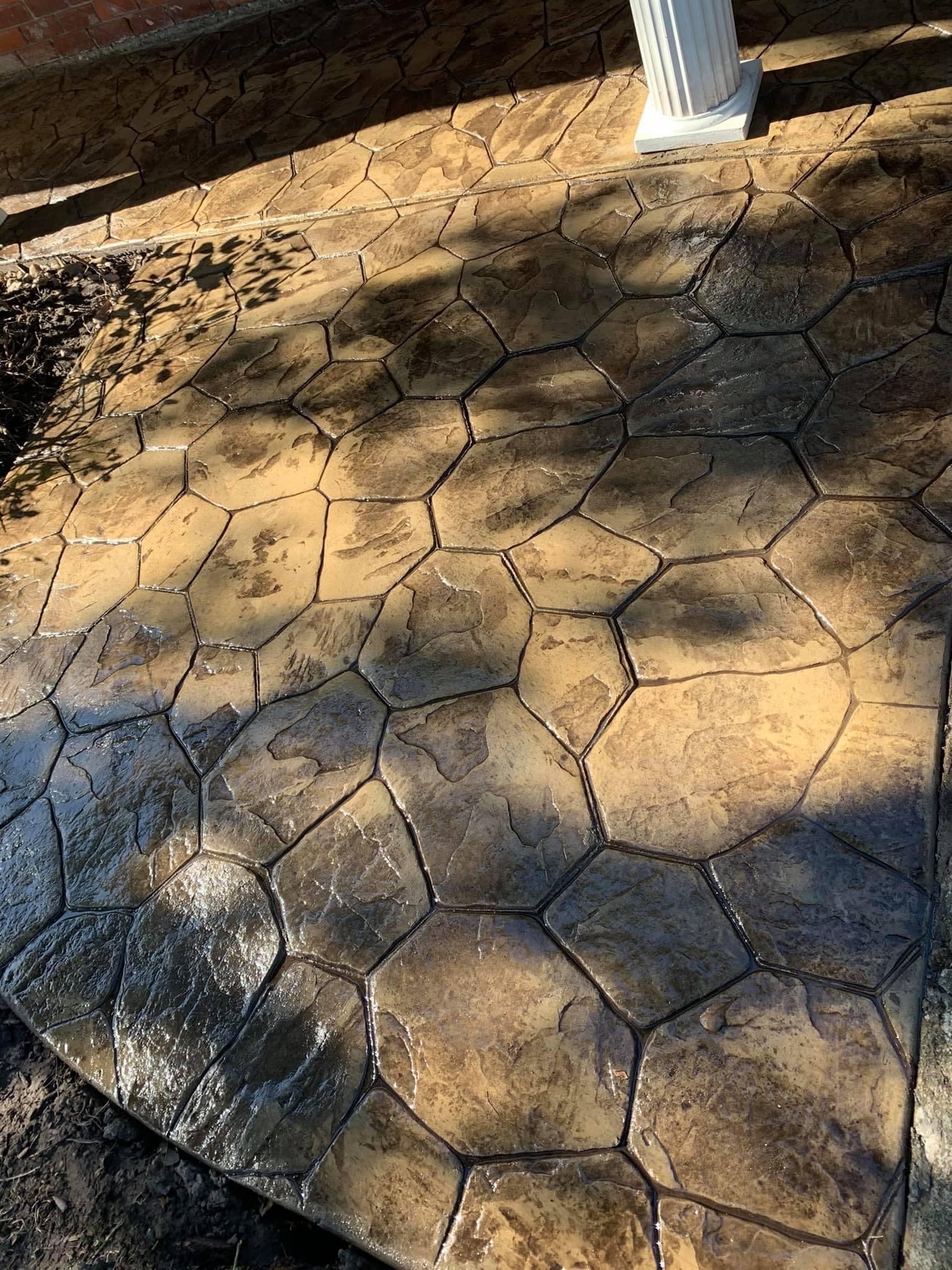 Stamped hexagon-pattern concrete patio finished in Houston, TX