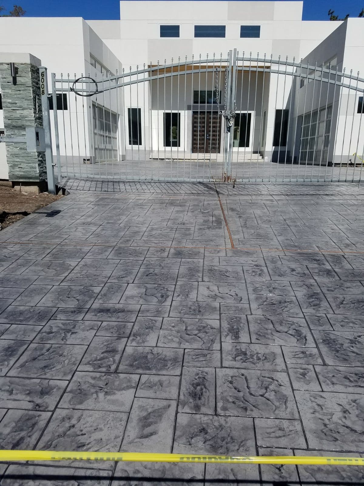 Large finished stamped concrete patio on a residential property