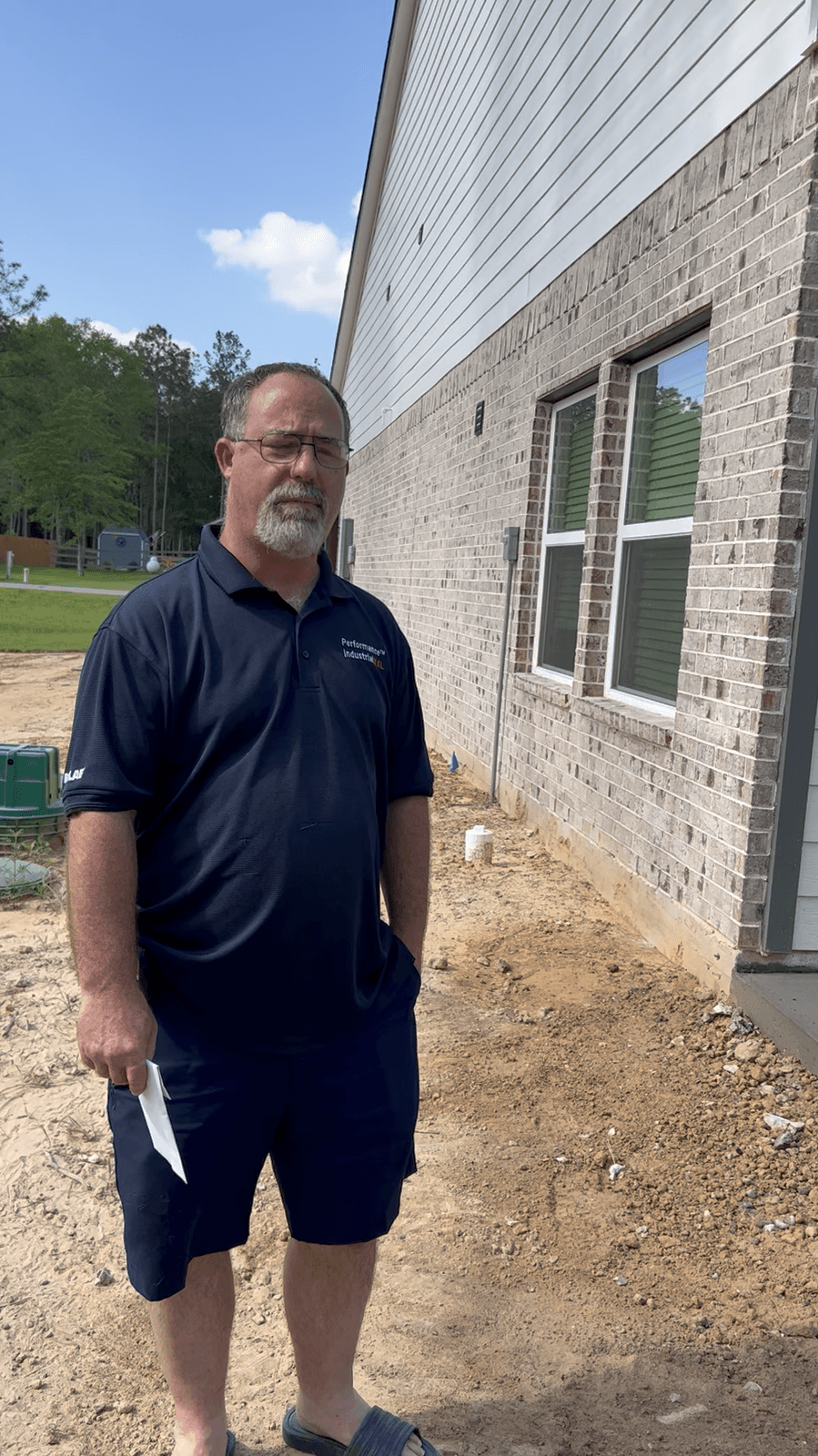 Iron Wolf Concrete crew member in front of a completed project